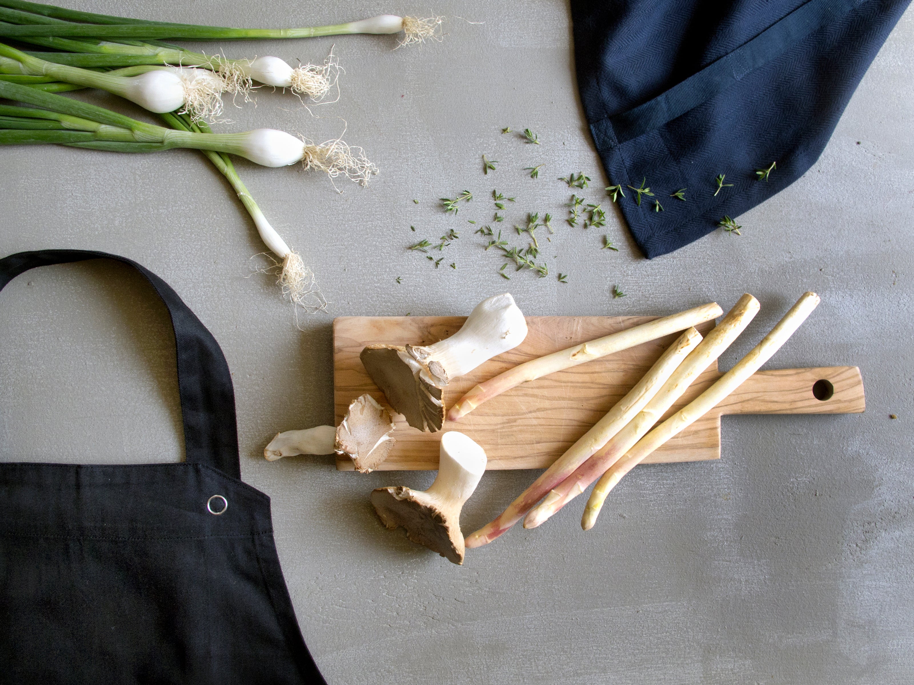 Cooking items like apron, towel and vegetables